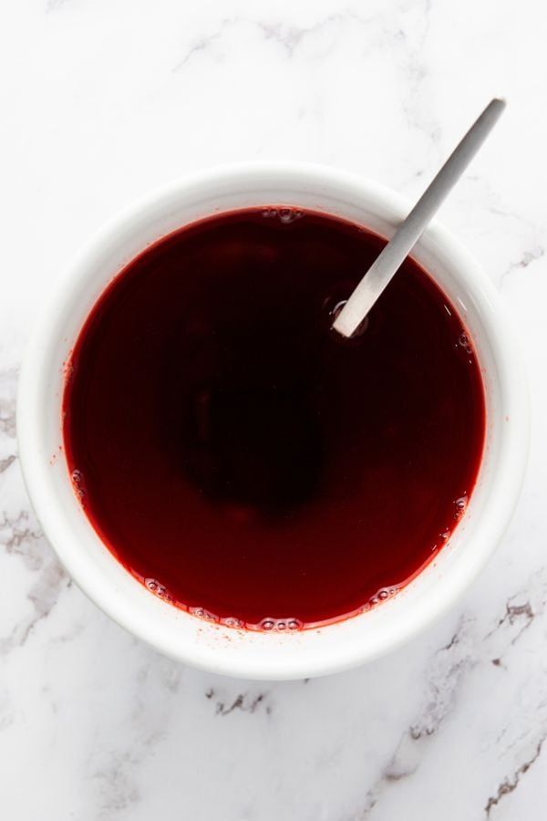 red jello mixture in bowl.