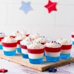 patriotic jello cups on chopping board.