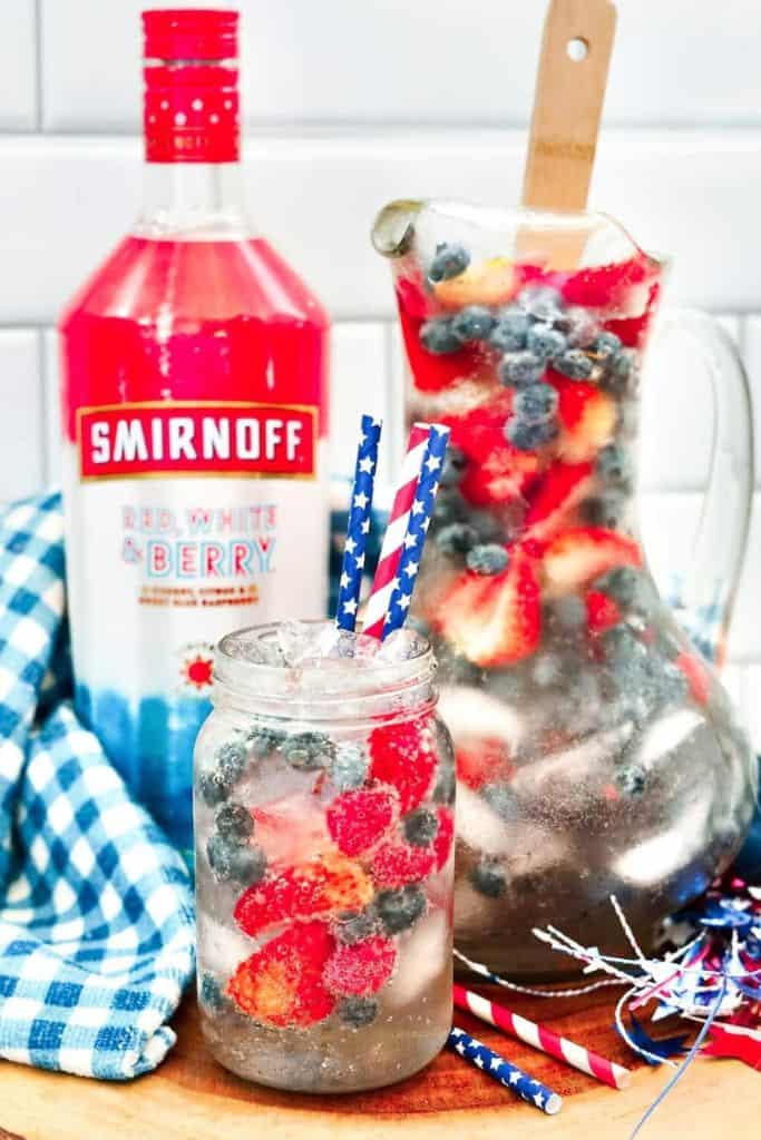 4th of july alcoholic lemonade in pitcher and glass.