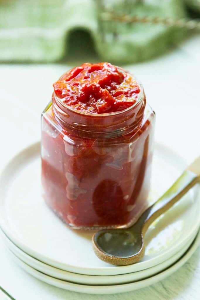 homemade rhubarb jam in glass jar.