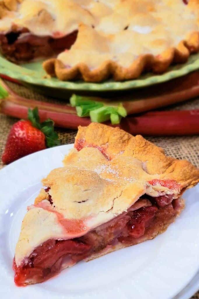 slice of rhubarb and strawberry pie with shortcrust pastry.