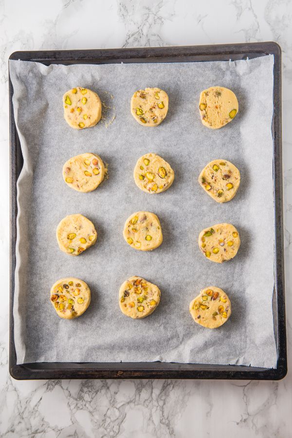 uncooked cookies on baking sheet.