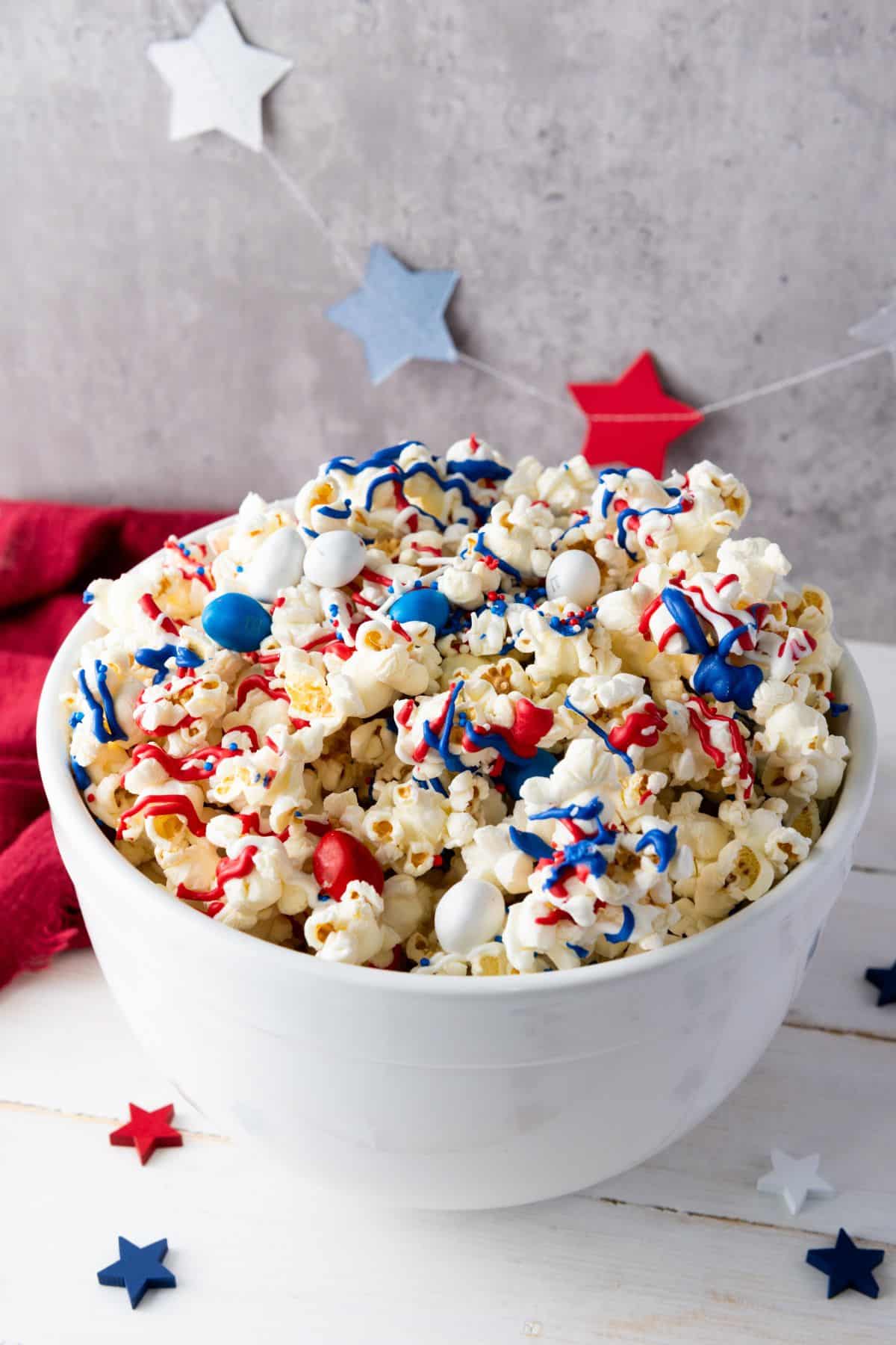 red white and blue candy popcorn in bowl.