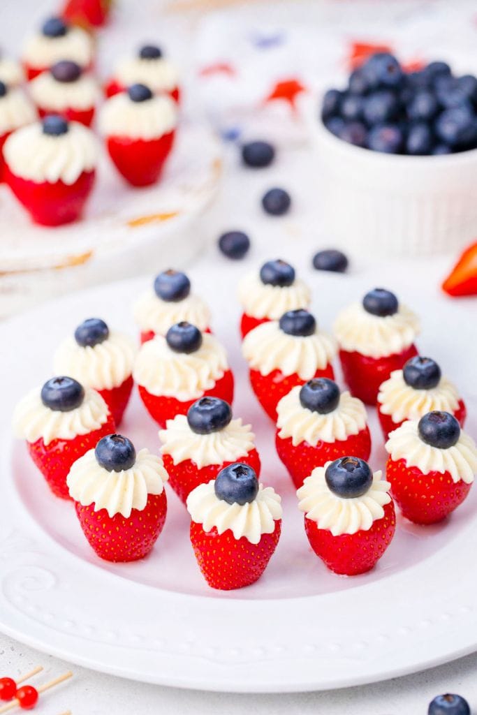 patriotic stuffed strawberries on platter.