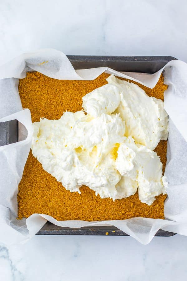 cheesecake mixture on crumb base in pan.