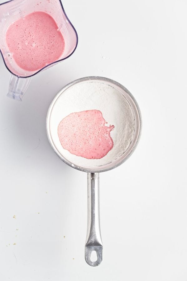 cornstarch slurry with raspberries in pan.