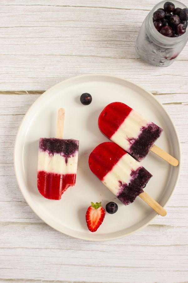 frozen fruit popsicles on plate.