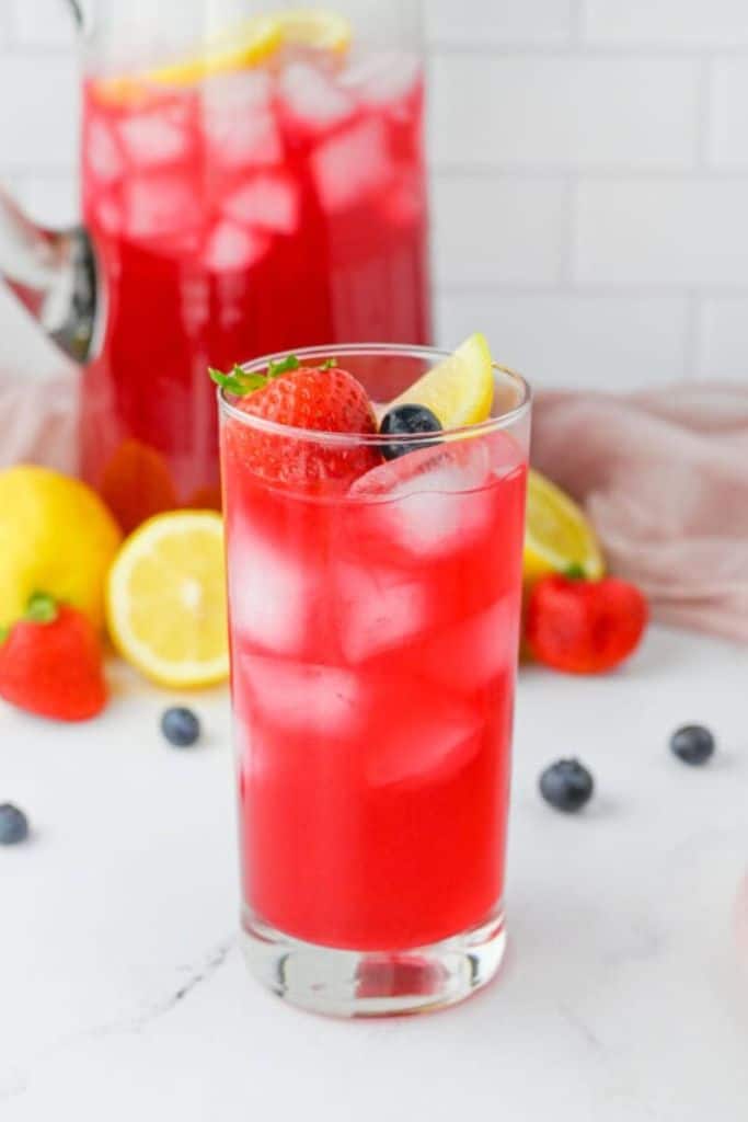 homemade berry flavored lemonade in glass.