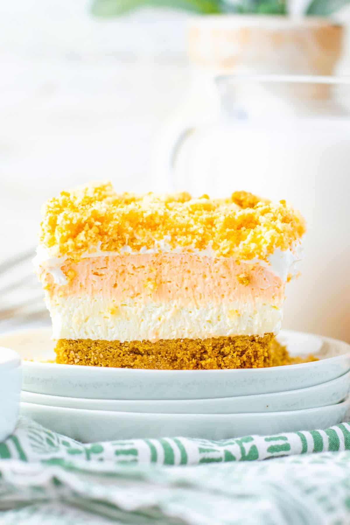 orange creamsicle bar with jello filling on plate.