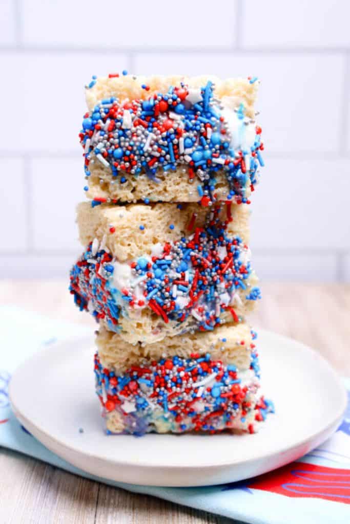 stack of rice krispie ice cream sandwiches with sprinkles.