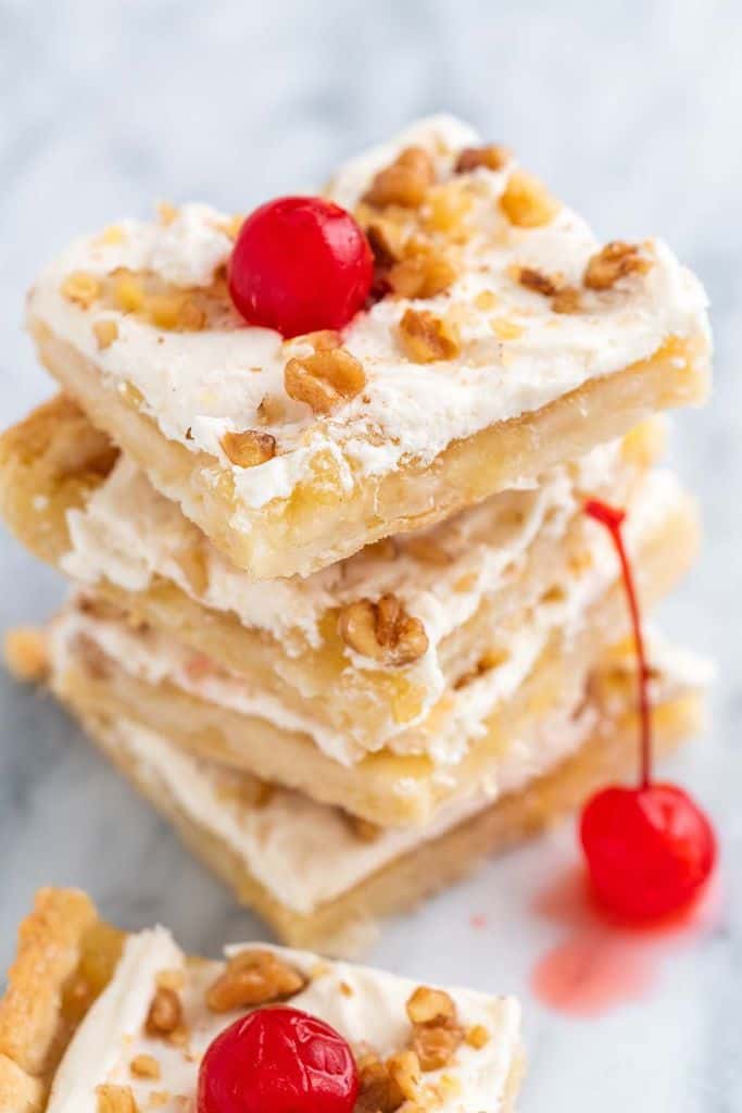 pineapple dessert squares stacked.