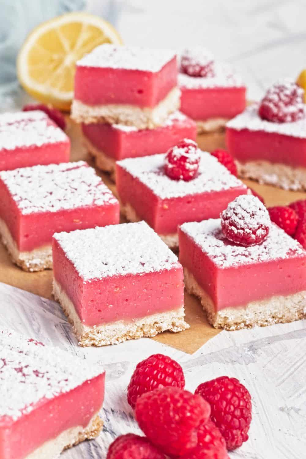 sliced raspberry bars dusted with sugar.