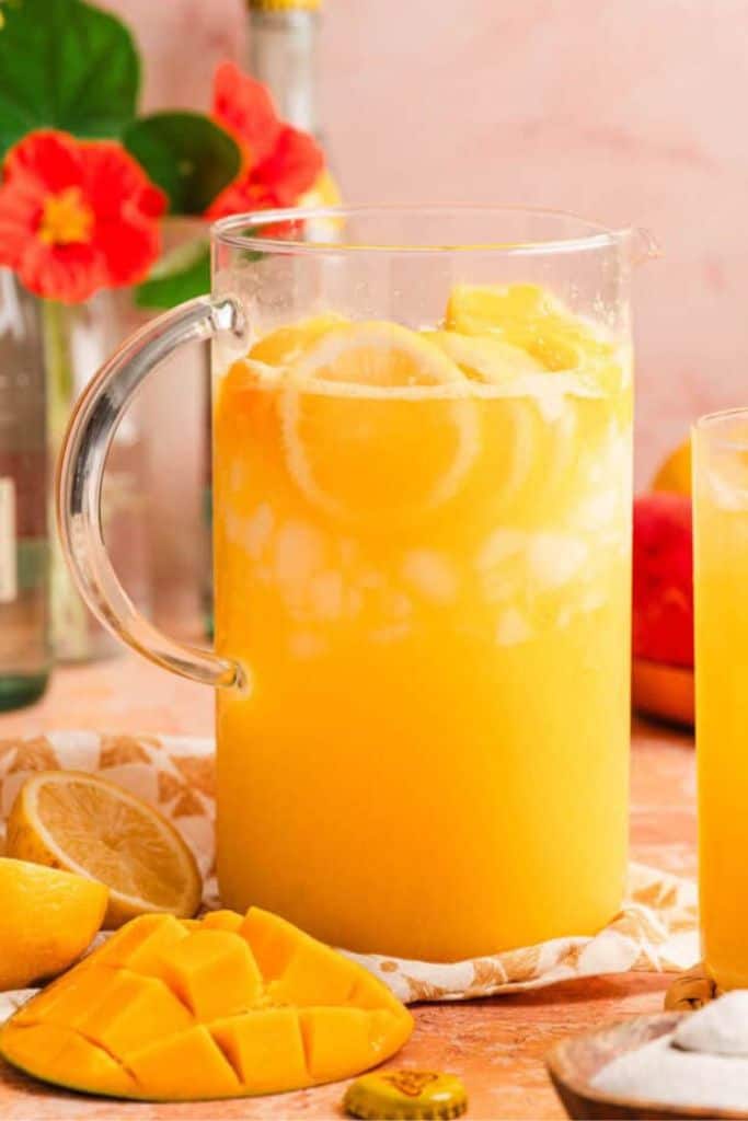 mango lemonade in pitcher.