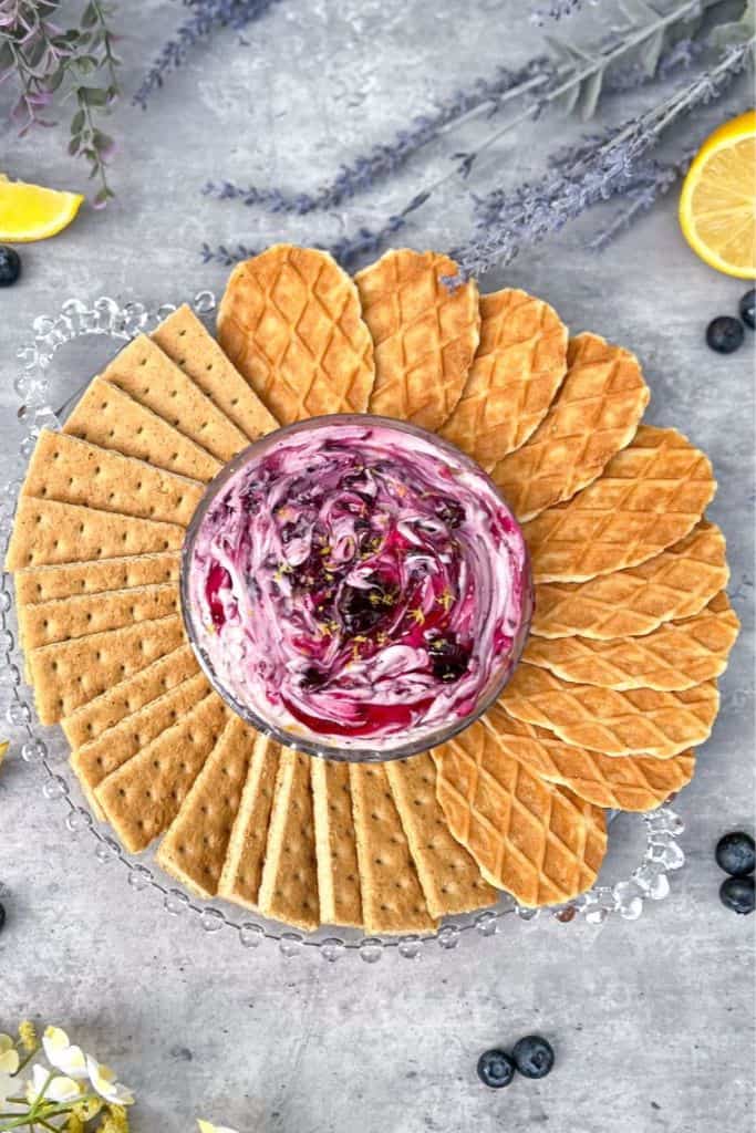 blueberry cheesecake dip with crackers.