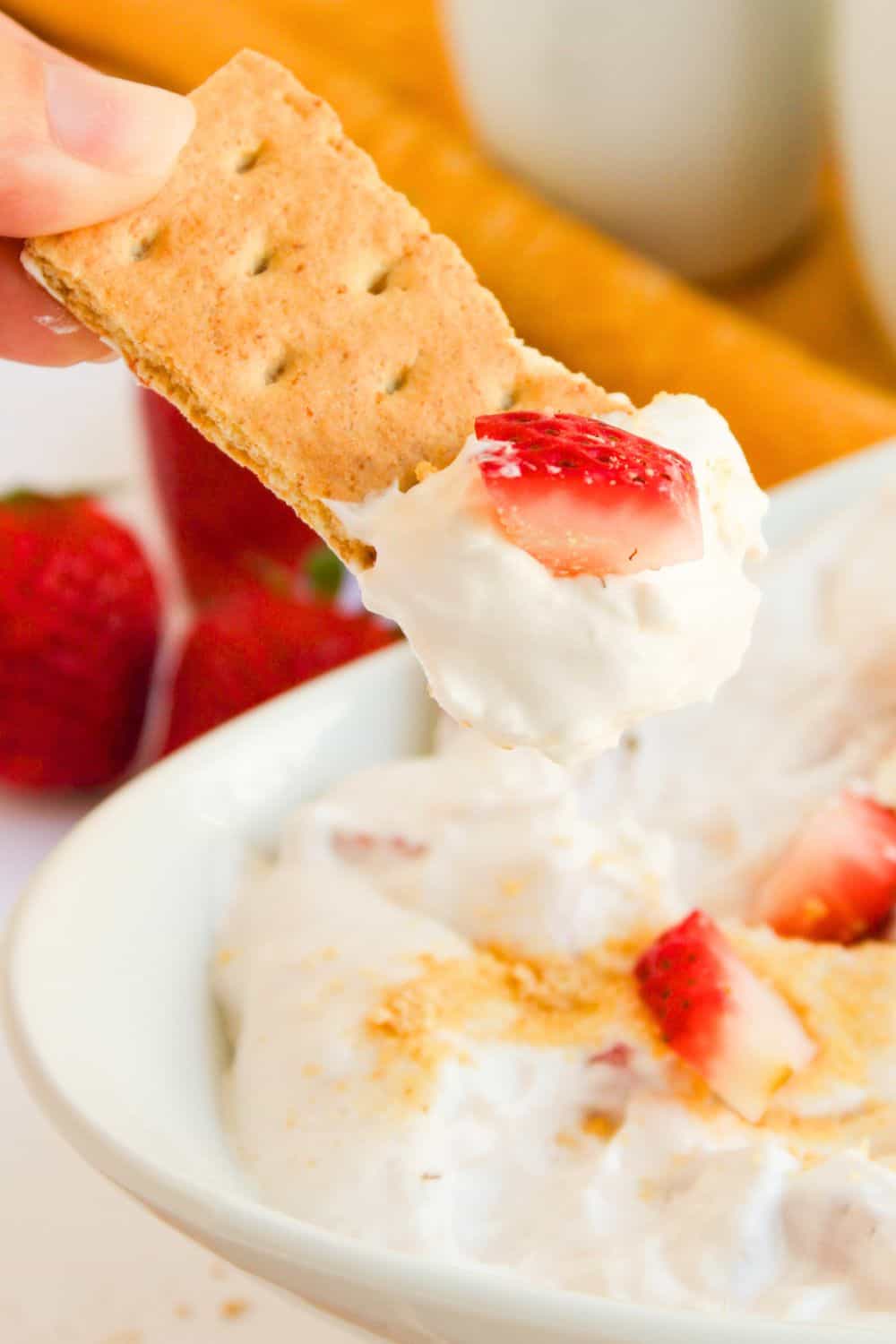 graham cracker with strawberry dip.