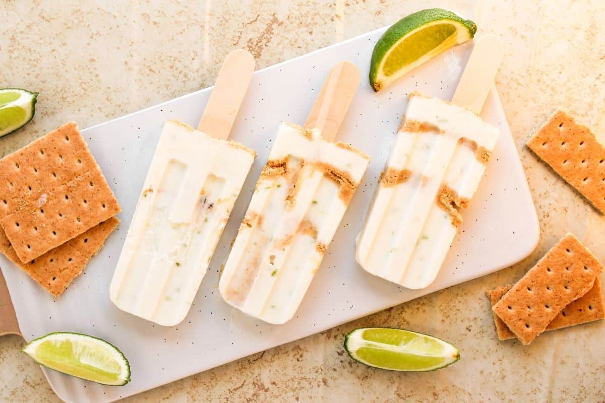 key lime pie popsicles on tray.