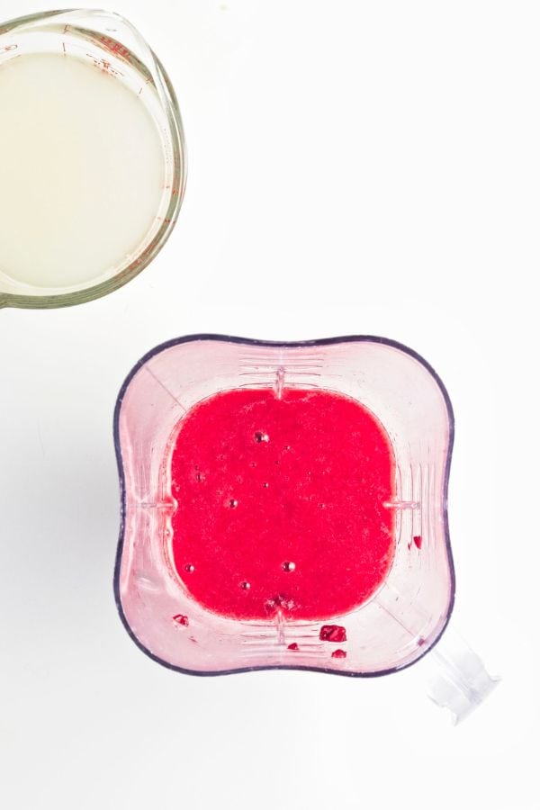 raspberry popsicle mixture in blender.