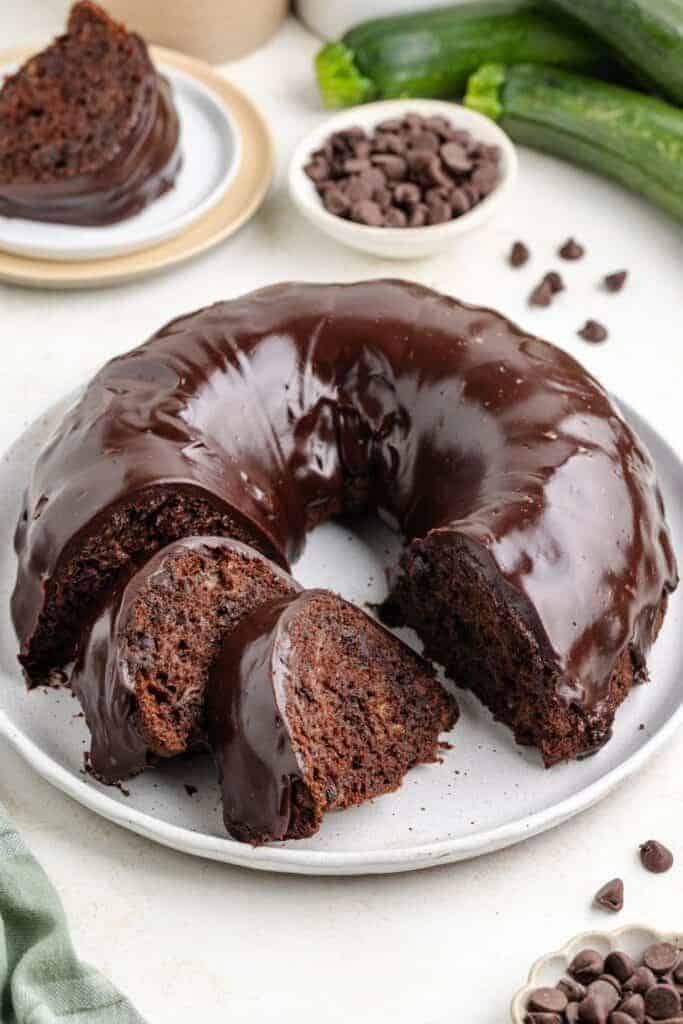 glazed chocolate zucchini bundt cake on plate.