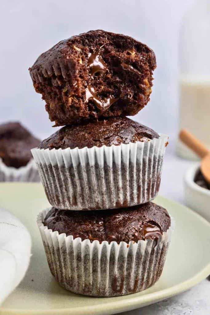 stack of three zucchini chocolate muffins.