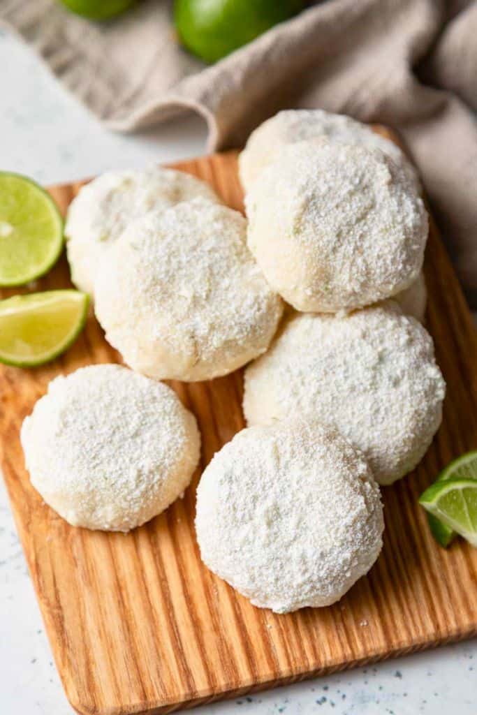 sugar dusted cookies on wooden board.