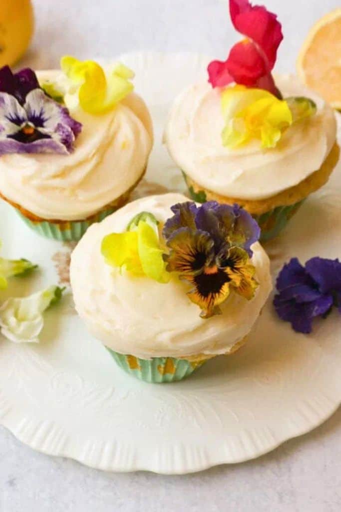 pretty lemon cupcakes with flower decorations.