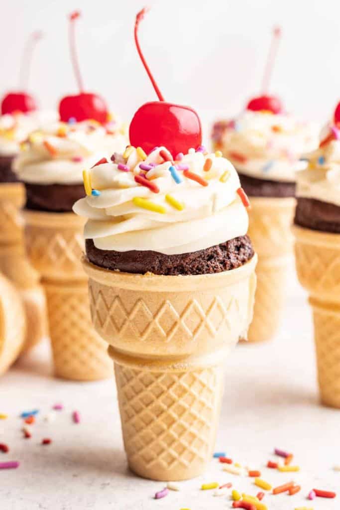ice cream cone cupcakes with cherry.