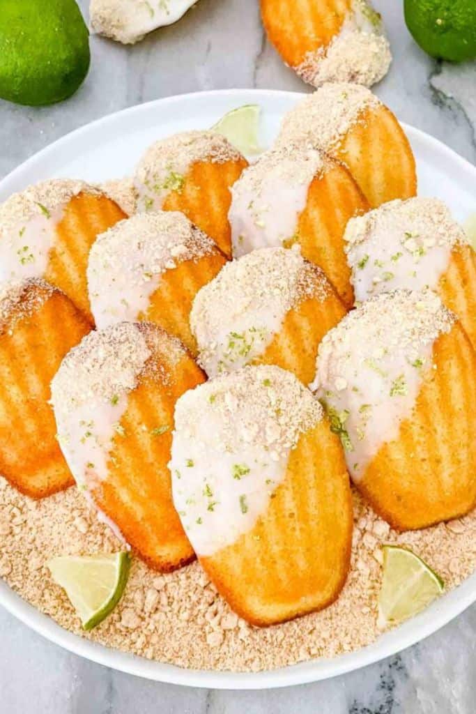 plate with key lime glazed madeline cakes.