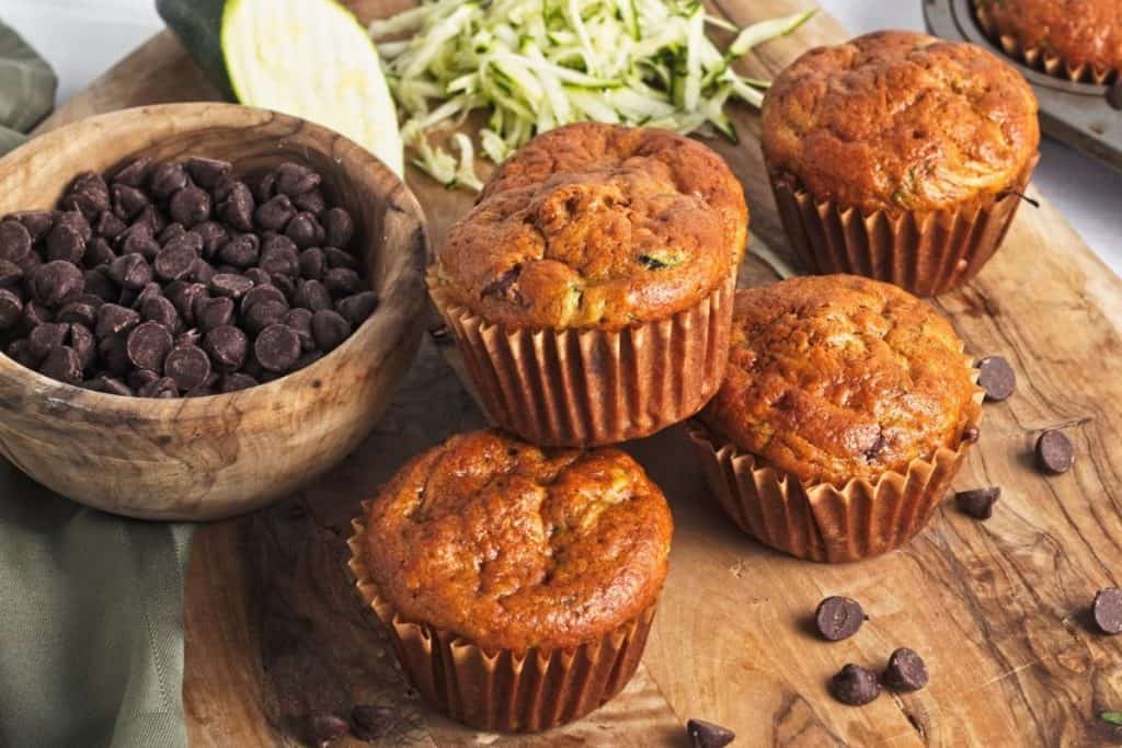 baked zucchini muffins on board.