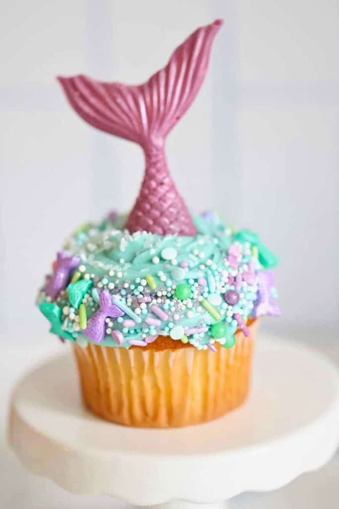 cute mermaid cupcake with decorations.