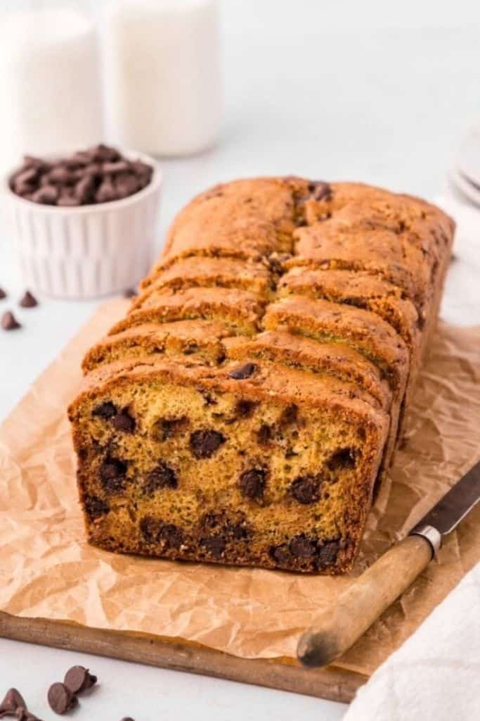 chocolate chip zucchini bread slided on wooden board.