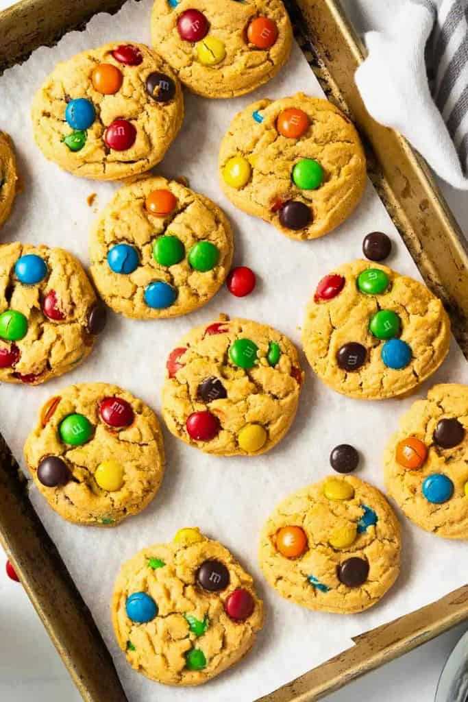 mm cookies with peanut butter on tray.