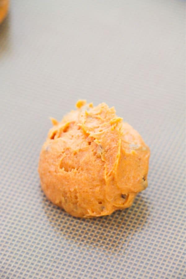 cookie batter scooped onto tray.