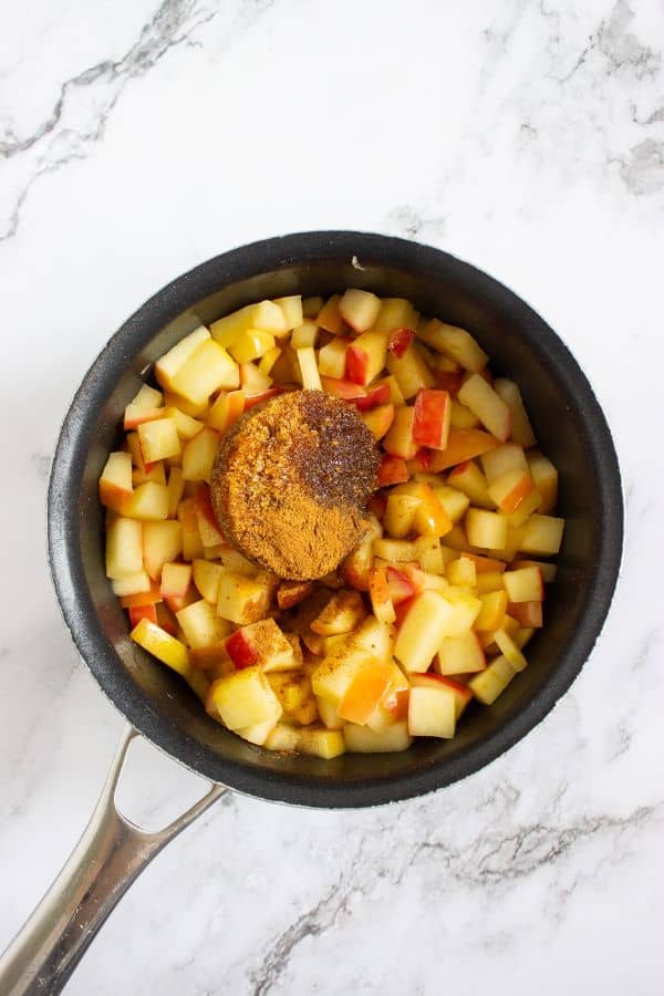 apple compote ingredients in pan.