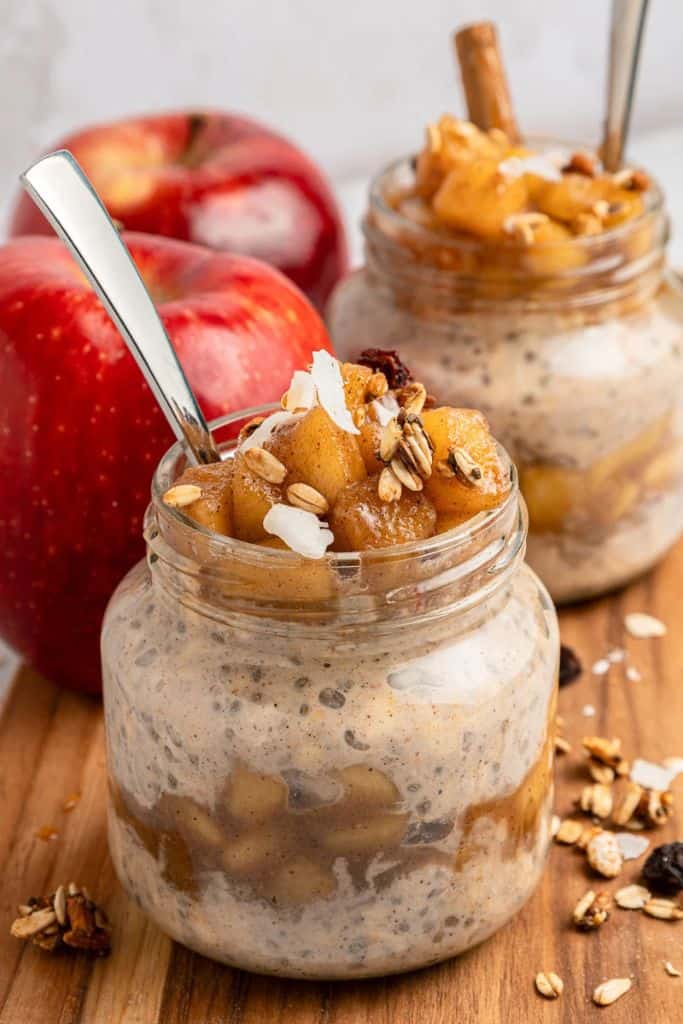 jar filled with apple overnight oats and topped with apple compote.