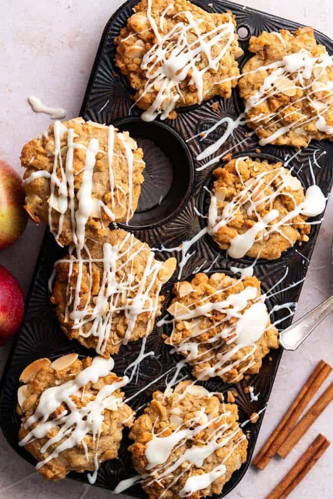 apple muffins with streusel topping in tray.
