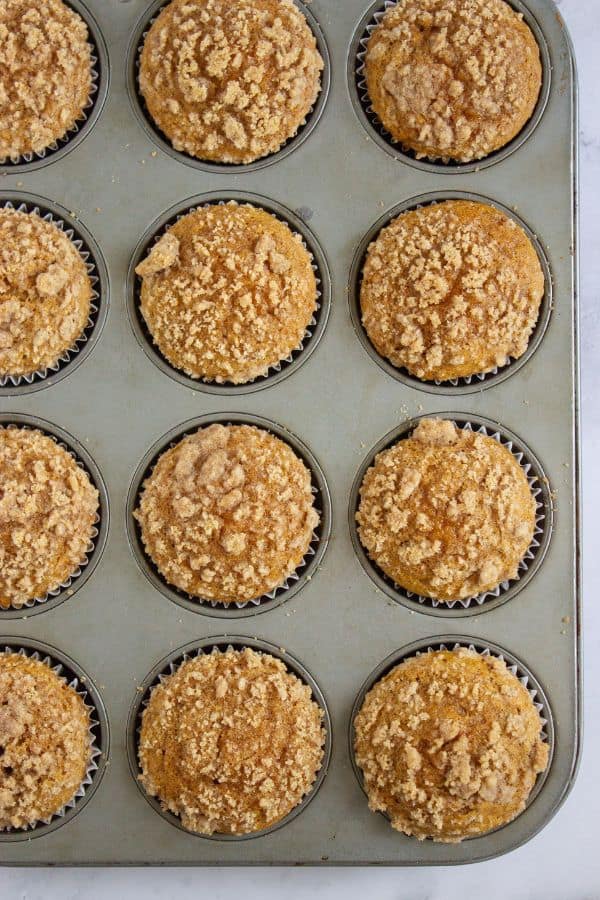 pumpkin streusel muffins in muffin tray.