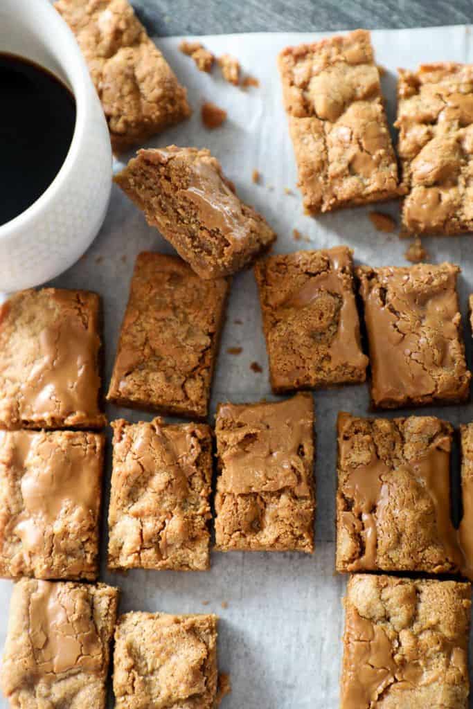 sliced biscoff blondies on parchment paper.