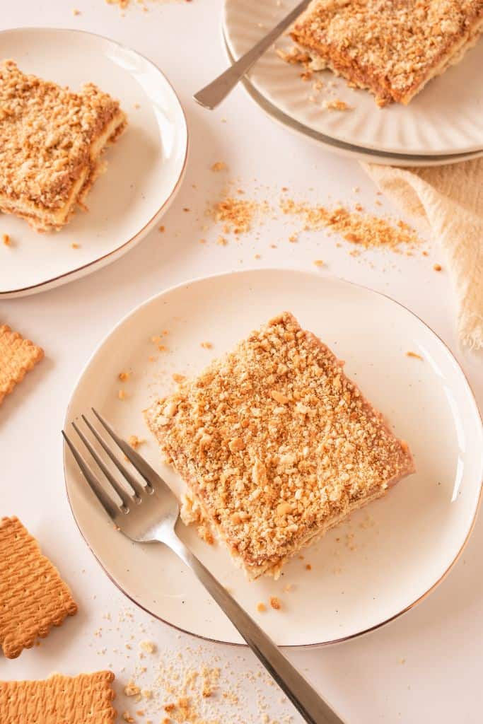 piece of lotus biscoff icebox cake on plate.