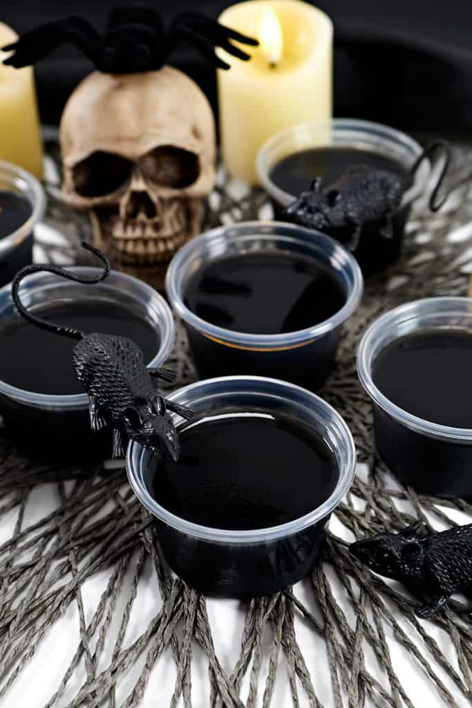 halloween black shots in shot cups.