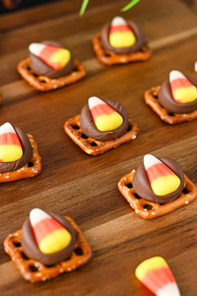pretzel bites with pieces of candy corn.