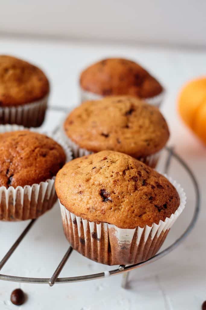 pumpkin coffee muffins on wire rack.