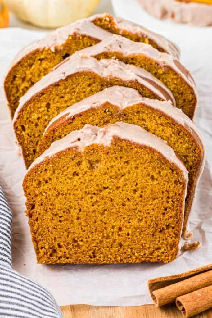 sliced pumpkin bread with glaze.