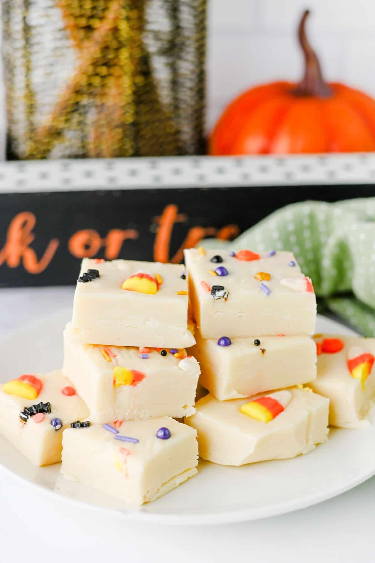 plate of halloween white fudge with sprinkles.