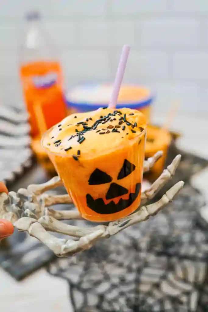 orange Jack O'lantern float in cup.
