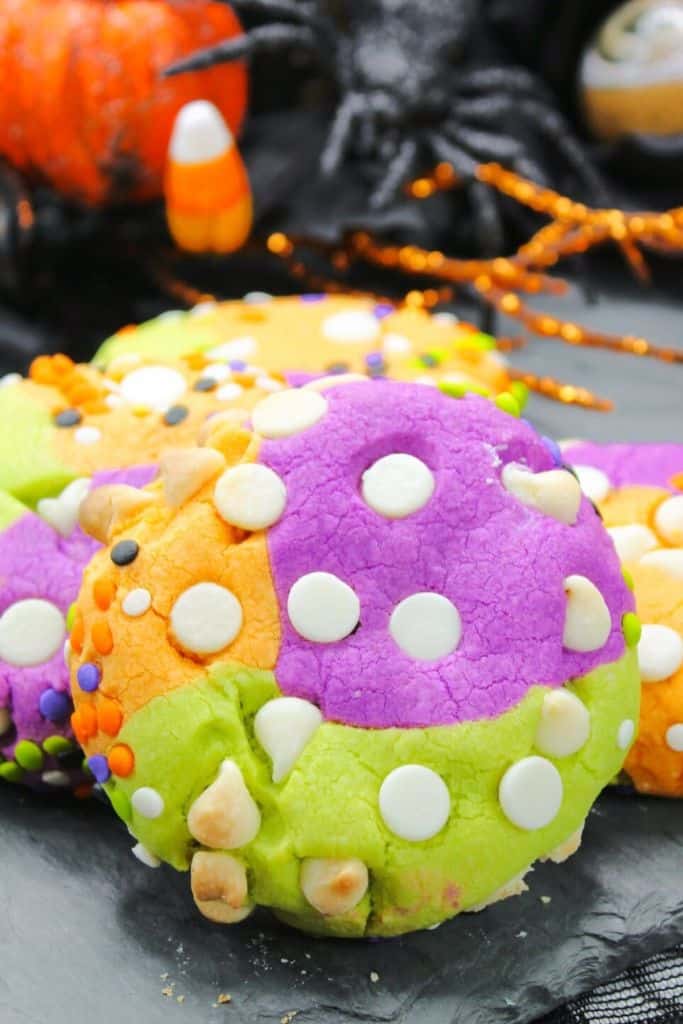 bright colored halloween cookies with sprinkles.