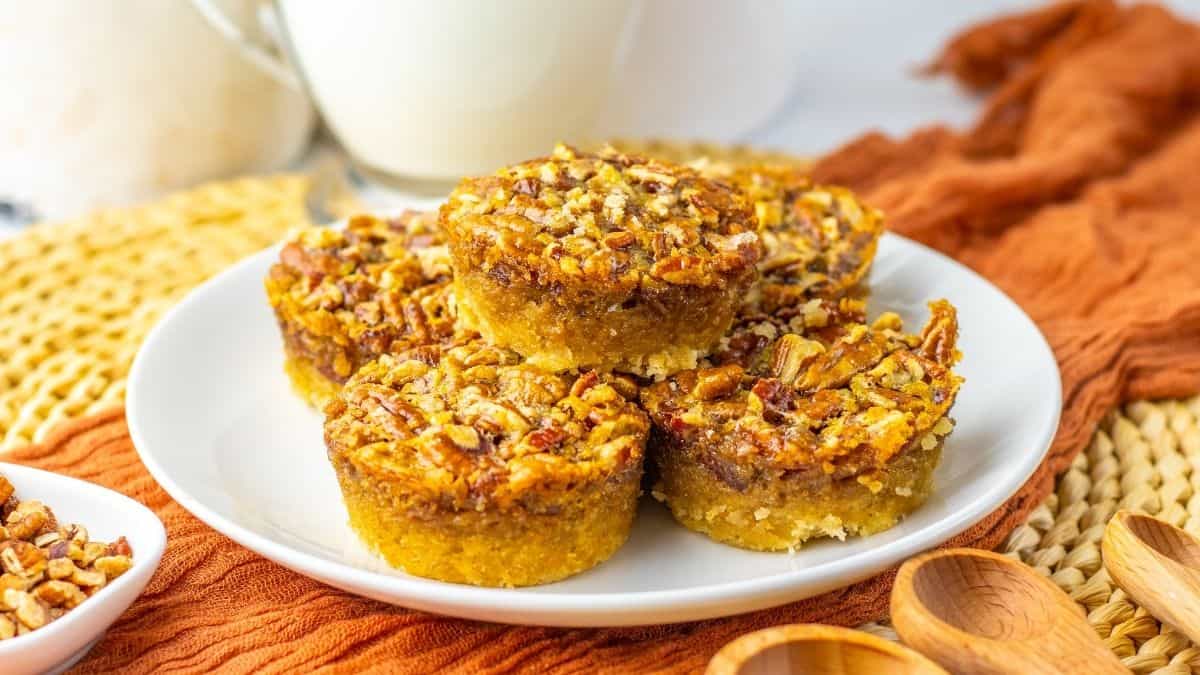 bite size pecan tarts on plate.