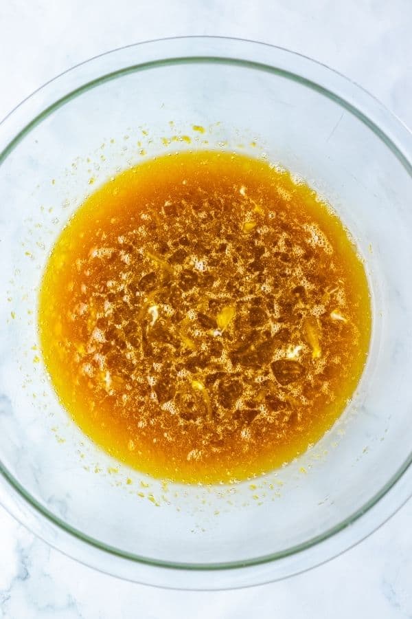 pecan pie filling ingredients whisked in bowl.