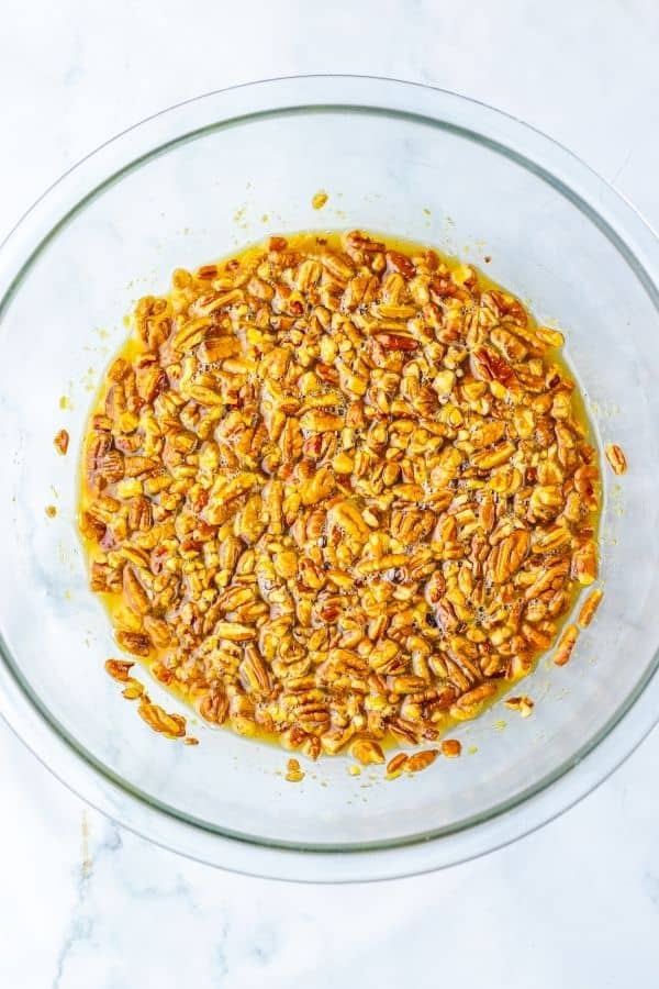 pecan pie filling with pecans in bowl.