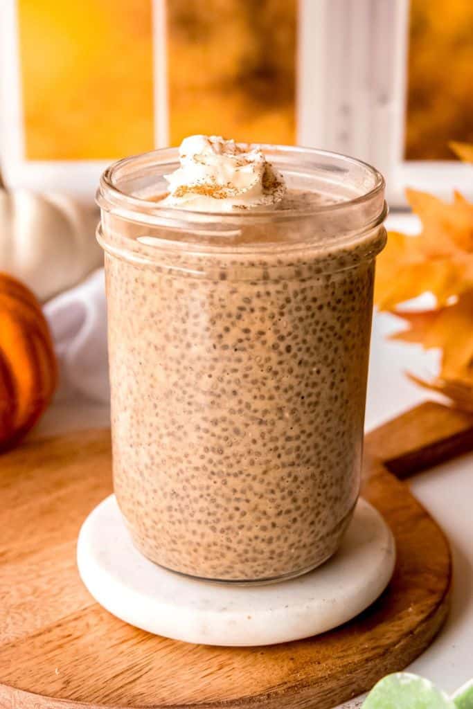 glass with pumpkin flavored chia pudding.