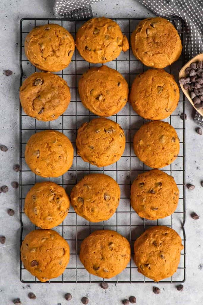 pumpkin choc chip cookies on wire rack.